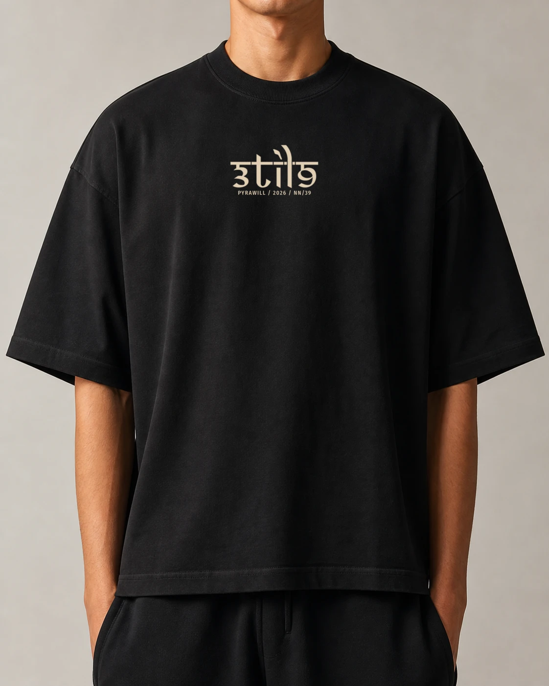 Front of the black Pyrawill 2026 boxy tee with the small 3til9 numbered signature