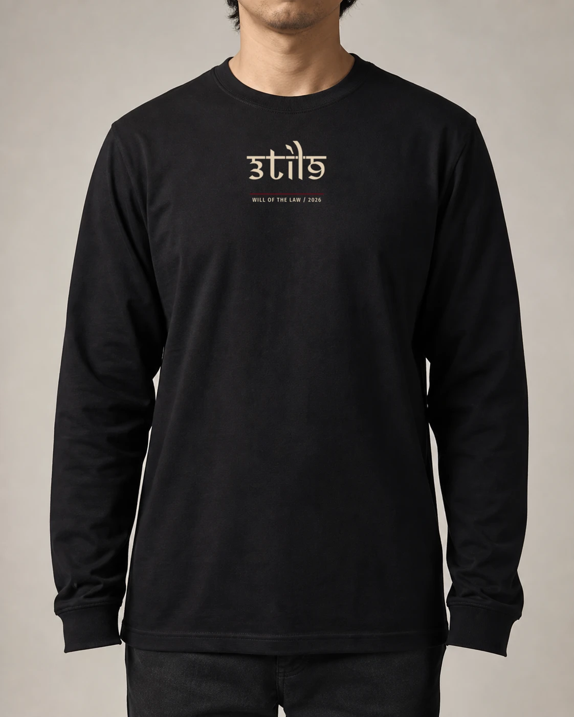 Front of the black Will of the Law long sleeve with a small bone 3til9 signature